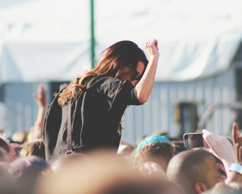 woman on top of crowd