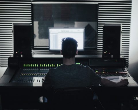 man sitting in front of computer setup