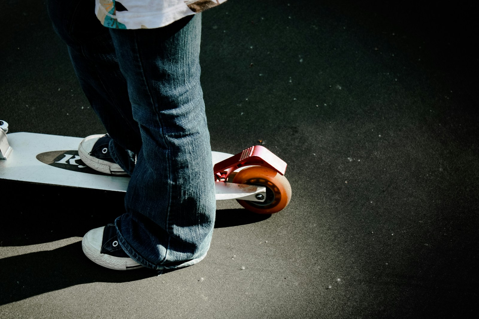 a person riding a skateboard on a street